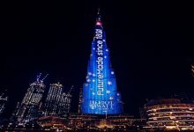 How are Dubai's Tall Buildings illuminated?